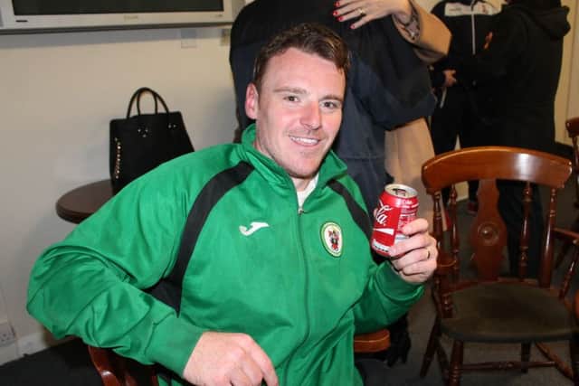 Joe celebrates with a soft drink. Picture by Colin Bowman