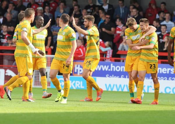 Yeovil Town's Harry Cornick is congratulated by his team-mates after scoring their winner to beat Crawley Town SUS-150921-134031002