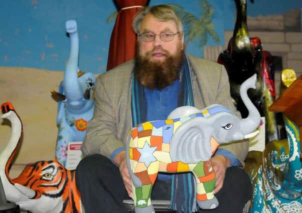 Brian Blessed with some of the charity elephants SUS-160125-142240001