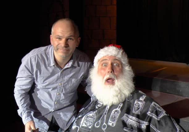 The real thing ... Santa gets ready to bid farewell to his beard