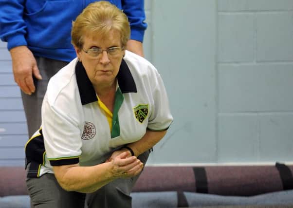 Marion Hatch bowls for the Crablands team in the over-60s triples / Picture by Kate Shemilt