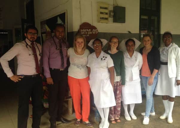 Kayley and Danielle with doctors and nurses from the Kandy Hospital in Sri Lanka