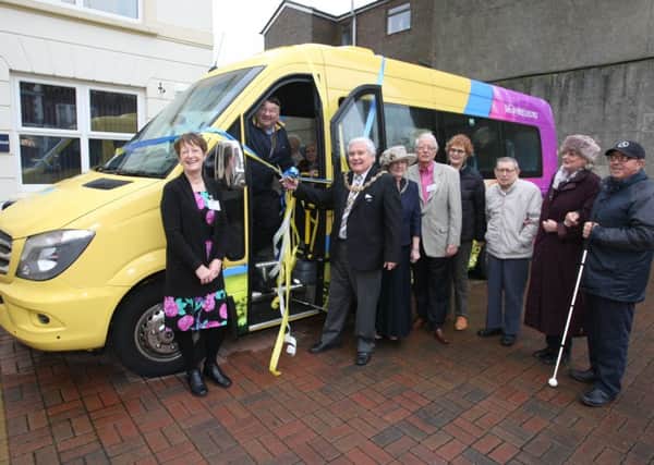 Worthing mayor Michael Donin cuts the ribbon to launch the new minibus. PICTURE: DEREK MARTIN dm1612365a