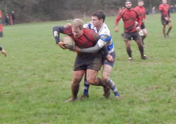 Hastings & Bexhill scrum-half Elliot Parry tackles a Vigo opponent. Picture courtesy Peter Knight