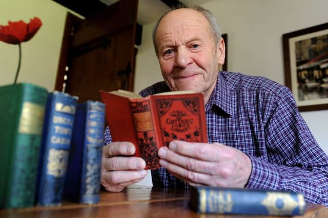 Lyle Milner holding 5 books from 1800s that were signed by a Worthing resident, he wants to track down his descendants and give them the books. Pic Steve Robards  SR1603283 SUS-160128-194528001