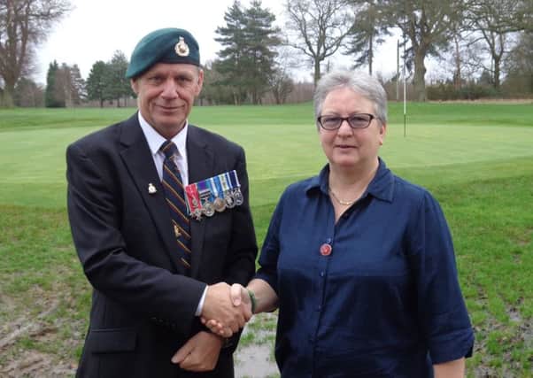 Help Our Wounded Royal Marines chair of trustees David Lilburn and Ruth Leatherbarrow, Lady Captain for 2016 at Cottesmore Golf and Country Club - picture submitted