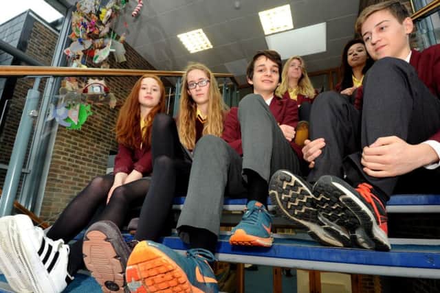 Pupils  at Bishop Luffa School, Thea Huxley, 15, Keziiah Heaton, 14, Max Lyndon-Smith, 15, Elliot Fox ,15, Bethan Davies 15, and Kira Greenwood 14 , just some off those wearing their own shoes to school to mark  Holocaust Memorial Day ks1600021-3