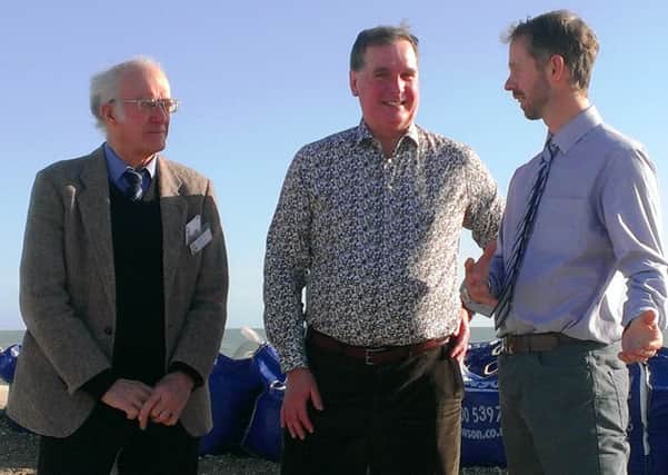From left: Ray Radmall, Robin Henderson and James Seymour talking in front of Paghams temporary defences