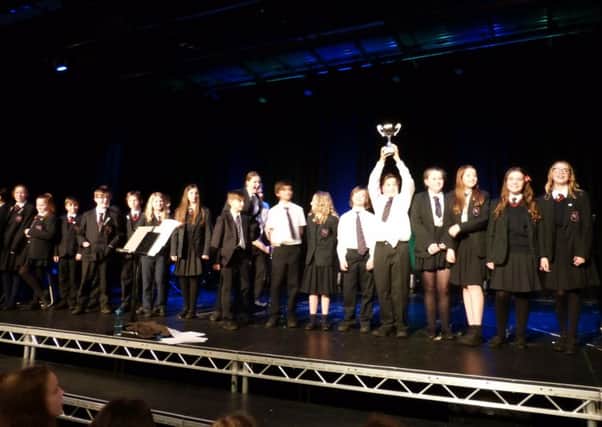 Tutor group 7CMK claims the cup in the Church Street Choir Competition, with their rendition of Livin on a Prayer