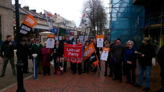 Protest against ESCC cuts in Eastbourne town centre SUS-160130-120725001