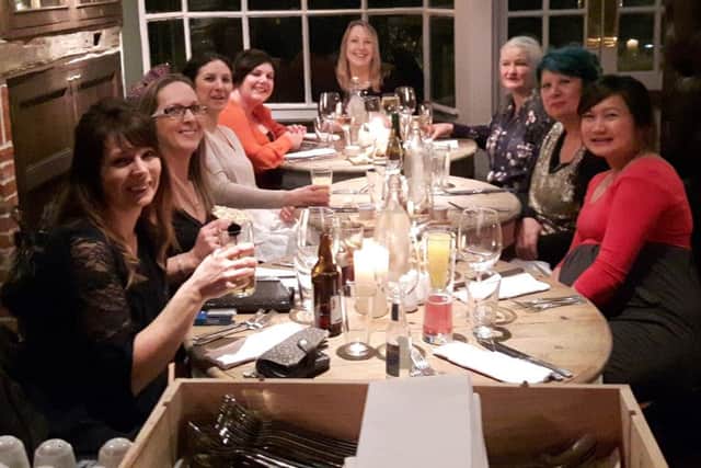 Grace Brown, right, with other diners who got together via Facebook for a night at The Wisborough - thanks to landlord Paul Gidley SUS-160202-100408001