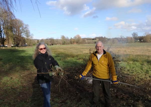 Town councillors Theresa Truscott and Brendan Flynn working on the clearance CONTRIBUTED