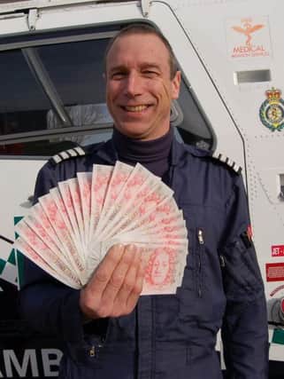 Air ambulance pilot, Captain Kevin Goddard with superdraw money SUS-160202-113526001