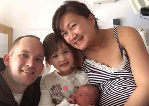 Grace Brown with husband Chris, daughter Holly and new baby Ben SUS-160102-142356001