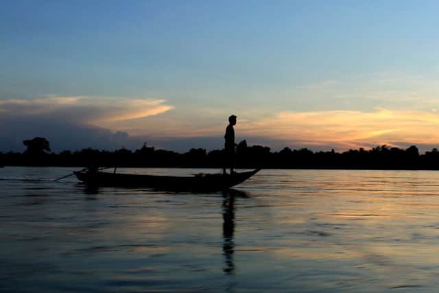 A fishing boat at sunset on the Mekong