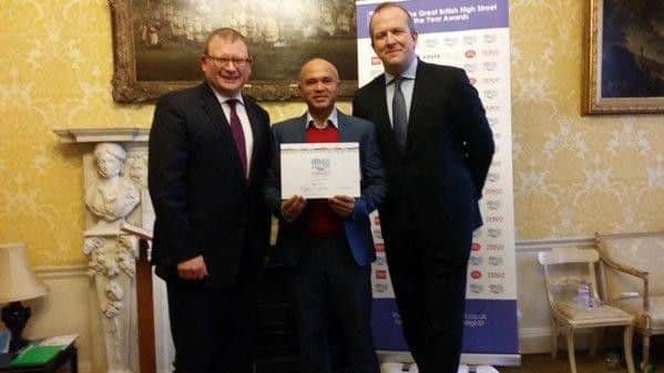 Marcus Jones, minister for local government, presents Toyubur Rahman with the Special Recognition award