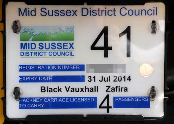 Mid Sussex District Council (MSDC) Taxi license plate. Pic Steve Robards SUS-140317-124142001