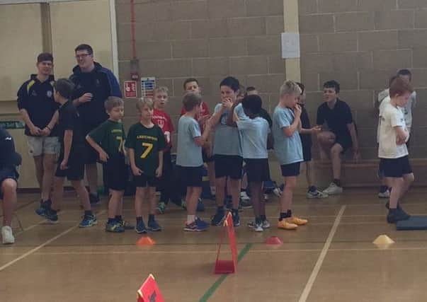 Horsham children taking part in the athletics competition SUS-161102-154046001