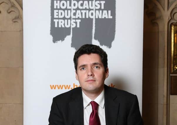 Bexhill and Battle MP Huw Merriman after signing the Holocaust Educational Trust's Book of Commitment