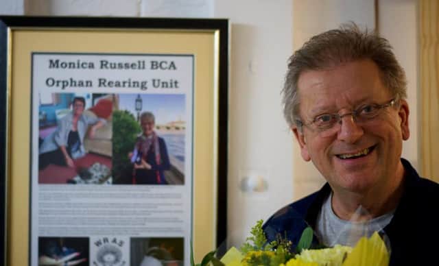 Brian Russell with a special framed dedication to Monica SUS-160802-150919001