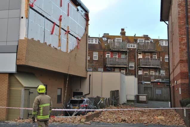 Bricks have fallen from the wall of Premier Inn, Eastbourne. Photo by Dan Jessup. SUS-160802-171232001