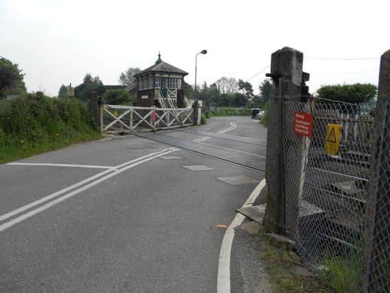 Plumpton level crossing with its original Victorian gates SUS-160701-115743001