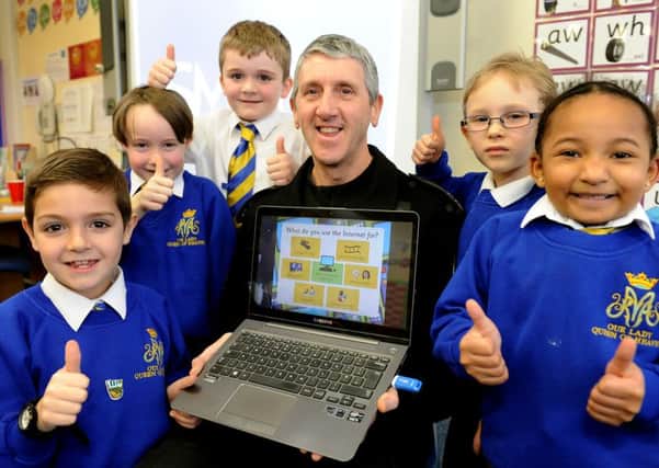 Our Lady Queen of Heaven held an eSafety Day to help the children protect themselves while online. The local community support officer PC Pearce took them through activities. Pic Steve Robards  SR1604152 SUS-160902-160559001