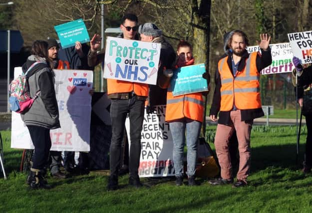 Demonstrators outside the Conquest Hospital in Hastings on the day of the junior doctors' strike. SUS-161201-111915001
