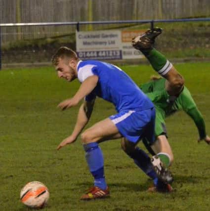 Max Miller gets the better of this challenge. Action from Haywards Heath Town's 3-0 victory over Crawley Down Gatwick. Picture by Grahame Lehkyj