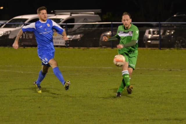 Rob O'Toole closes down defender. Action from Haywards Heath Town's 3-0 victory over Crawley Down Gatwick. Picture by Grahame Lehkyj