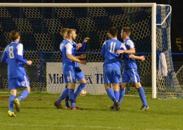 Celebrating Callum Saunders' goal. Action from Haywards Heath Town's 3-0 victory over Crawley Down Gatwick. Picture by Grahame Lehkyj