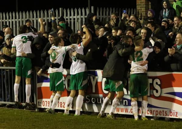 Players and fans celebrate the win / Picture by Tim Hale