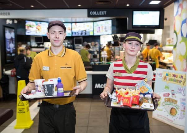 Â© Joel Goodman - 07973 332324 - all rights reserved . NO ONWARD SALE OR SYNDICATION PERMITTED - ONLY FOR USE IN REPORTING THE LIVE STORY TO WHICH THE PHOTOGRAPH IS RELATED . 14/08/2015 . Hyde , UK . McDonalds' order screen and waited table service at their branch in Mottram , Hyde . Photo credit : Joel Goodman SUS-161002-122901001