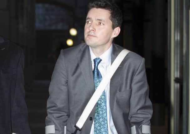 FILE PIC - Huw Merriman, MP for Bexhill and Battle leaves East London Employment Tribunals Service, Tower Hamlets, after attending an employment tribunal where city lawyer Pattie Campbell is claiming unfair dismissal today. Case continues today 9/2/16. SUS-160902-133552001