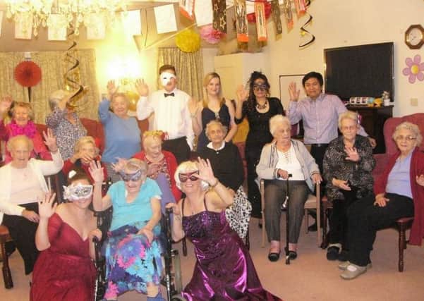 Summerlands residents enjoying the masquerade ball SUS-161002-163907001
