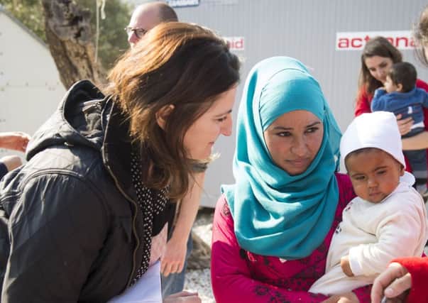 Conservative MP Caroline Ansell chats to Syrian mother Samar* and her two month-old daughter Nahla*, inside Save the Children's Child Friendly Space during a visit to the Kara Tepe refugee camp on Lesvos, Greece. SUS-160302-144337001