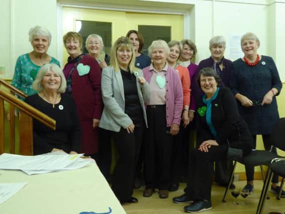 Maria Caulfield MP with Kingston WI's green hearts SUS-161102-124231001