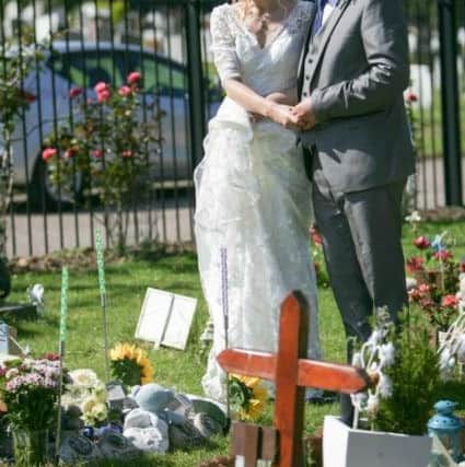 Dawne and Ian Braine visiting George's grave after they got married in July, 2013