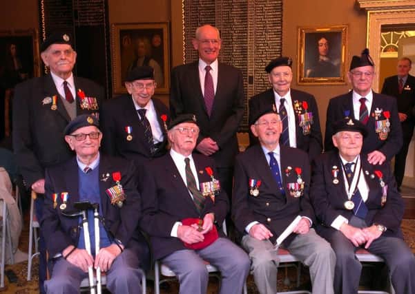 Captain Francois Jean, Consul Honoraire of France, centre of the back row, presented the veterans with the Chevalier (Knight) degree of the Legion DHonneur at Chichester