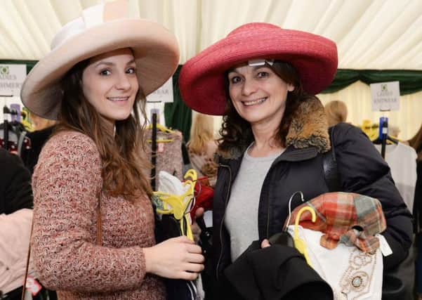 Designer clothes sale in aid of For Rutland In Rutland at Barnsdale Lodge. Debbie Sorter and Diana Nicols try out the hats. Photo: Alan Walters MSMP-27-02-15-aw005 EMN-150203-112429001