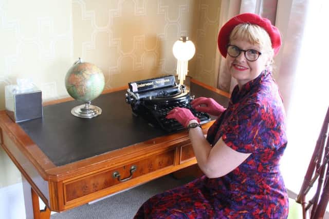 Genista Davidson with her typewriter