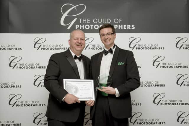 Simon Newbury receives his Image of the Year award from the Guild of Photographers. Picture by Foster Photographers SUS-160217-110816001
