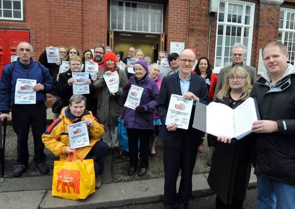 A  petition to keep Bognor Post Office open was presented to MP Nick Gibb, centre, by Paul and Marion Wells, right.ks1600045-1