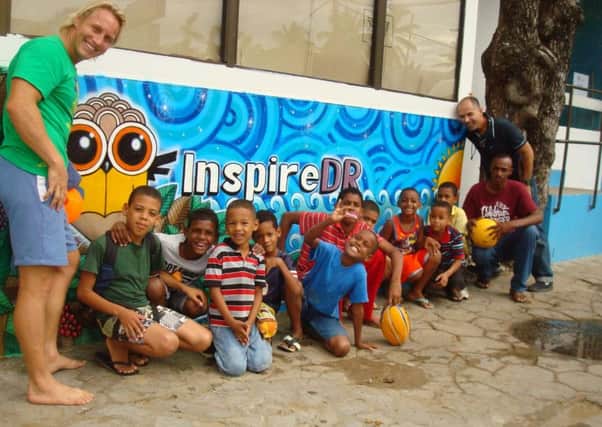 Project founders Adam Gutman and Stefan Van der Spek with some of the children the project has helped