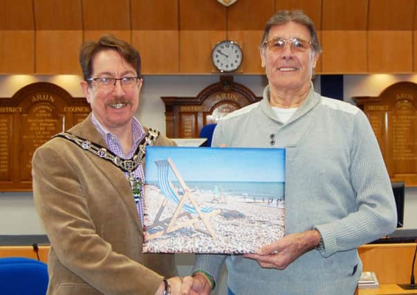 John Batley receives a picture from Arun District Council chairman Andy Cooper