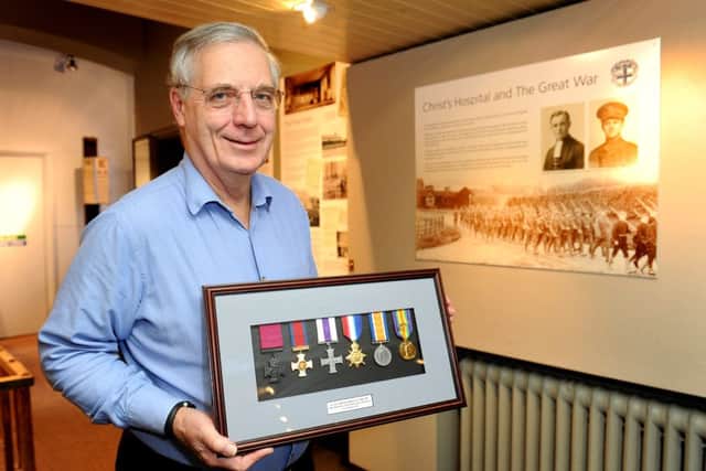 Mike Barford (Hon Curator of the CH Museum) Christ's Hopsital The Great War exhibition. Mike's holding replica medals belonging to  Lt Col. Wilfrith Elstob VC; DSO; MC   Pic Steve Robards  SR1605094 SUS-160219-125924001