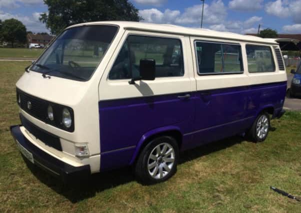 The campervan which appears purple or blue in different light