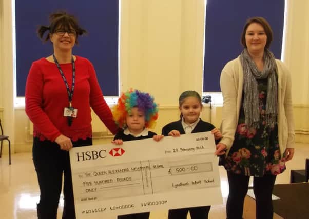 Wendy Coombes, left, with pupils Sam Clark and Aleisha Golds, and Samantha Stokes, community and events fundraiser at Queen Alexandra Hospital Home