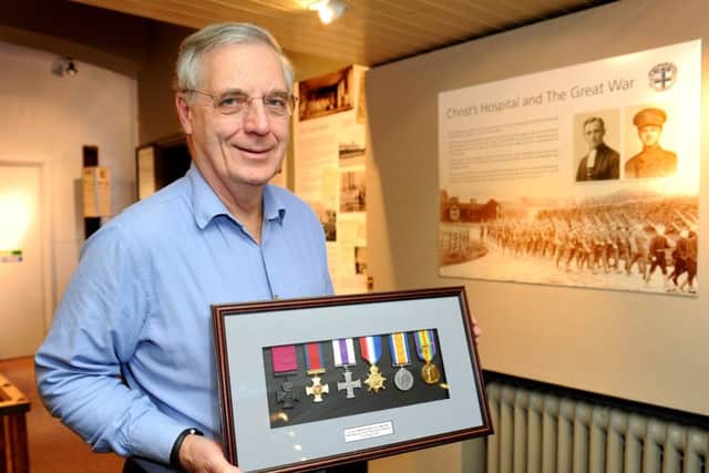 Mike Barford (Hon Curator of the CH Museum) Christ's Hopsital The Great War exhibition. Mike's holding replica medals belonging to  Lt Col. Wilfrith Elstob VC; DSO; MC   Pic Steve Robards  SR1605094 SUS-160219-125924001