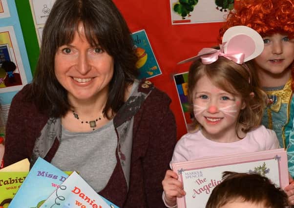 Children's author Julie Fulton reads from her books to children from Winchcombe Farm Day Nursery for World Book Day. NNL-150303-125955009